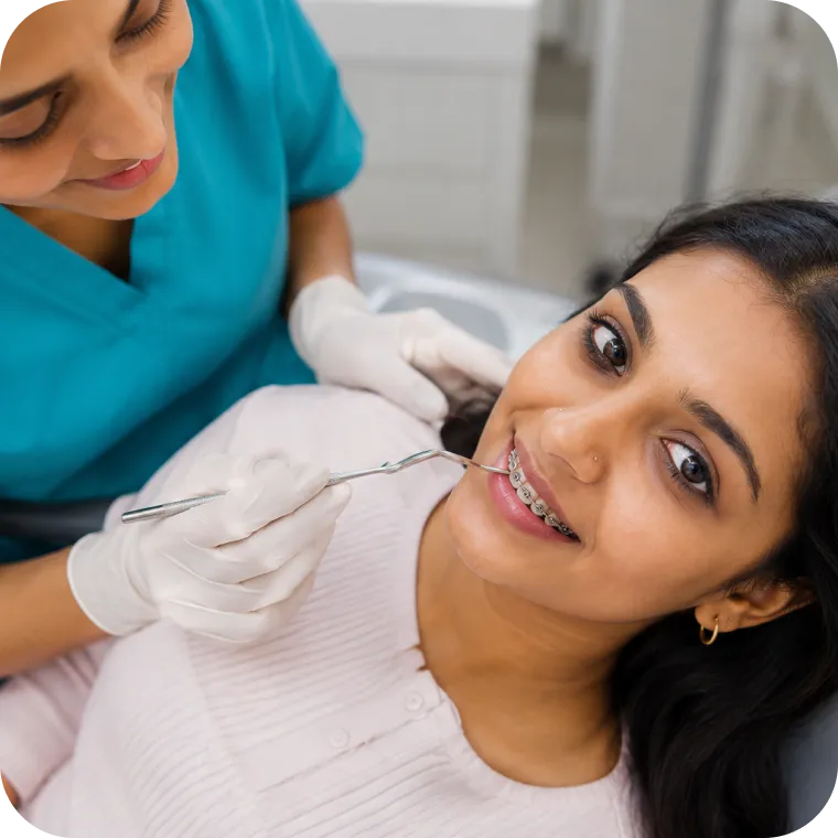 Patient receiving a braces check-up